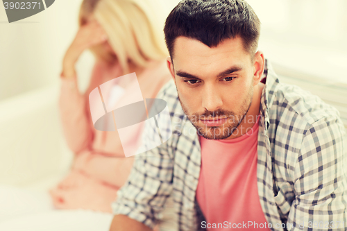 Image of unhappy couple having argument at home