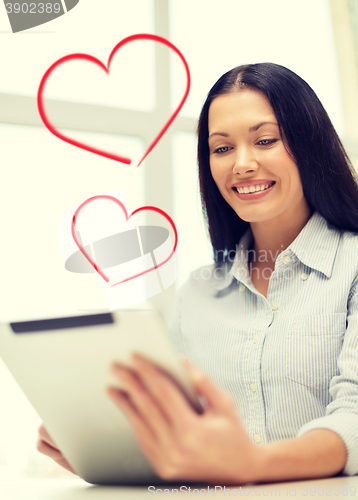 Image of smiling businesswoman or student with tablet pc