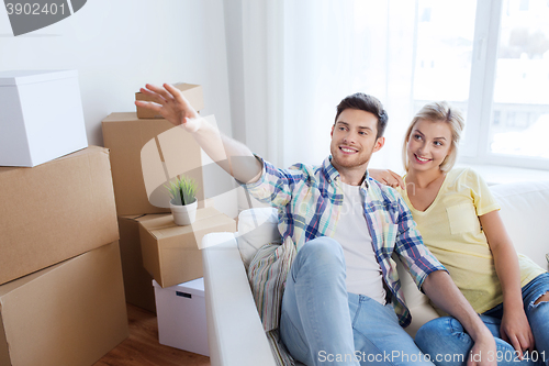 Image of couple with boxes moving to new home and dreaming