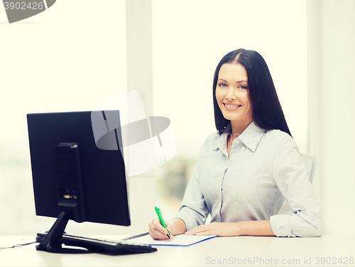 Image of smiling businesswoman or student studying
