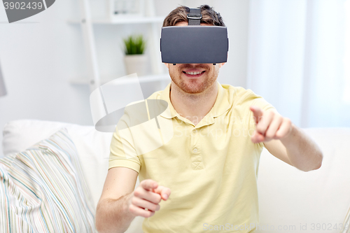 Image of young man in virtual reality headset or 3d glasses