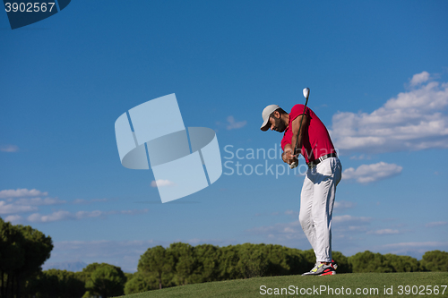 Image of golf player hitting long shot