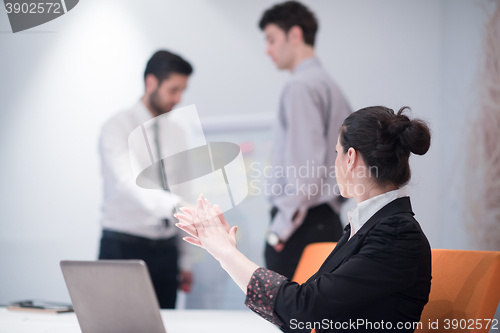 Image of young business woman on meeting  using laptop computer