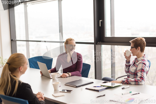 Image of young business people group on meeting at modern office