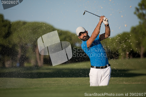 Image of pro golfer hitting a sand bunker shot