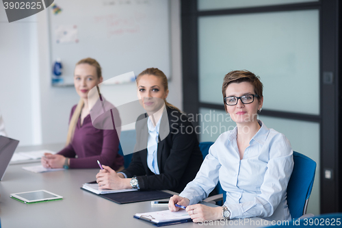 Image of young business people group on team meeting at modern office