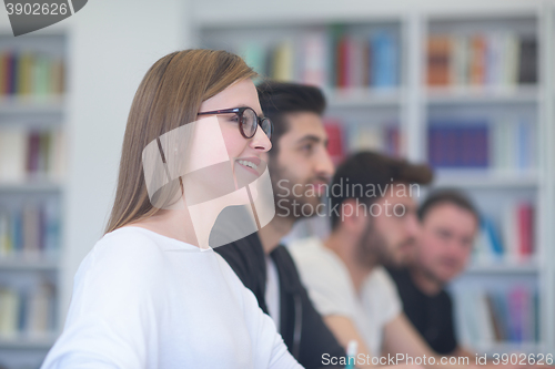 Image of group of students study together in classroom