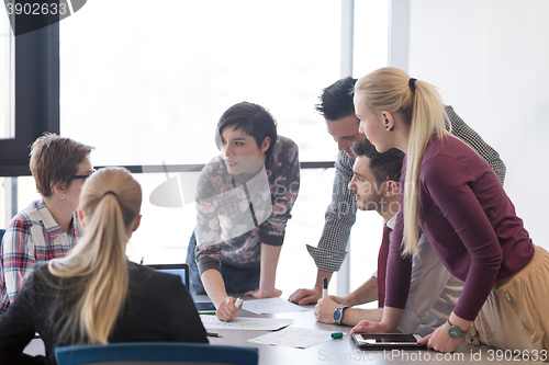 Image of young business people group on meeting at modern office