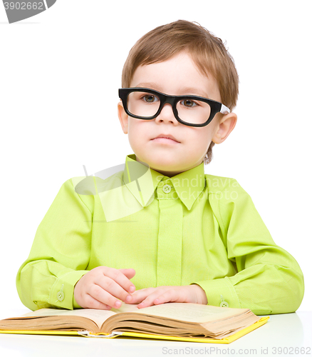 Image of Little child play with book