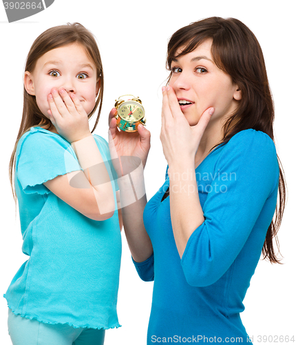 Image of Little girl and her mother are anxious about time