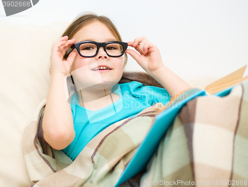 Image of Little girl is reading a book