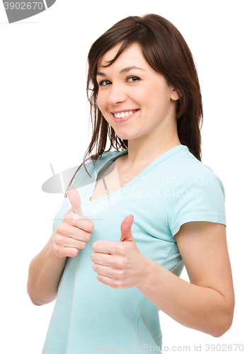 Image of Woman is showing thumb up gesture