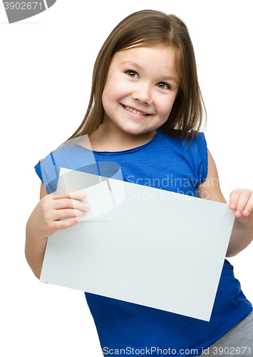 Image of Little girl is holding blank banner