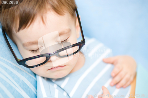 Image of Cute little boy is sleeping