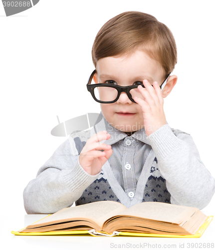 Image of Little child play with book