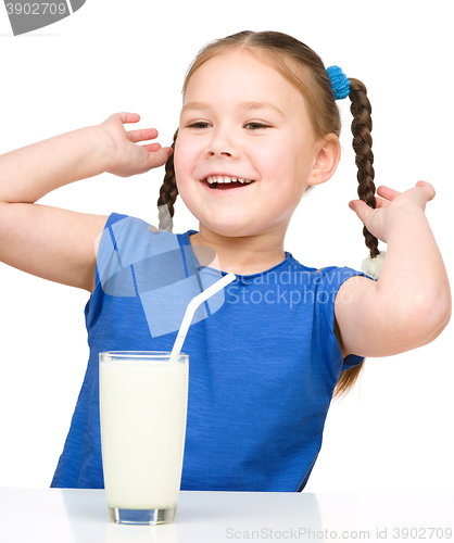 Image of Cute little girl with a glass of milk