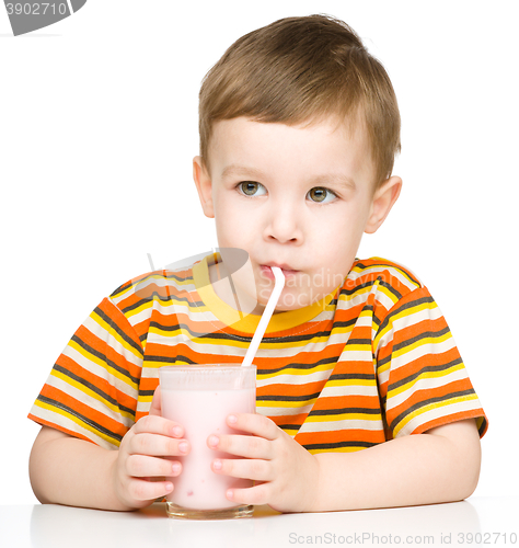 Image of Cute little boy with a glass of milk