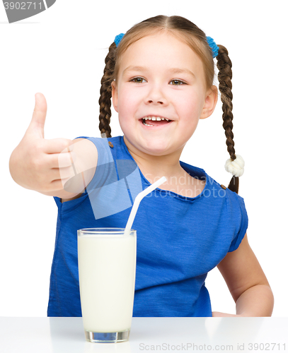 Image of Cute little girl with a glass of milk