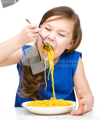 Image of Little girl is eating spaghetti