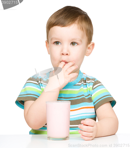 Image of Cute little boy with a glass of milk