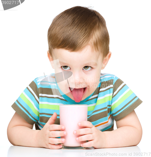 Image of Cute little boy with a glass of milk