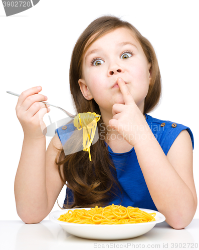 Image of Little girl is eating spaghetti