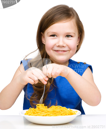 Image of Little girl is eating spaghetti