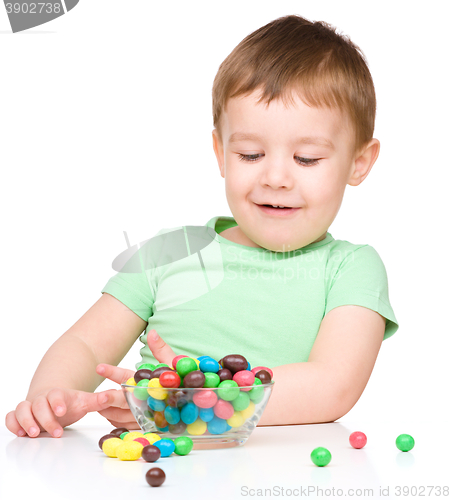 Image of Portrait of a boy with candies