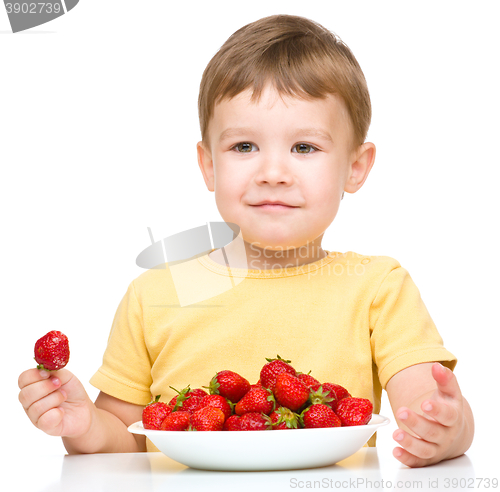 Image of Little boy with strawberries