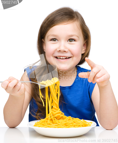 Image of Little girl is eating spaghetti