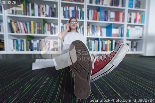 Image of female student study in library