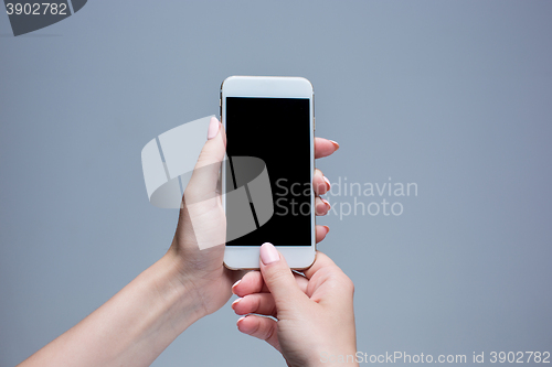 Image of Closeup shot of a woman typing on mobile phone 