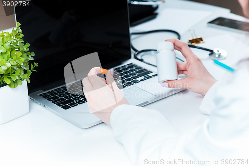 Image of The doctor with pill in hospital