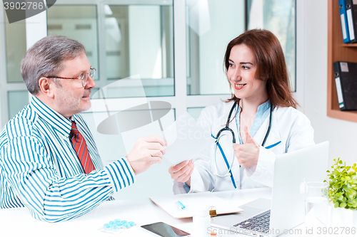 Image of The patient and his doctor in medical office