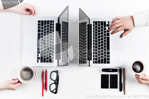 Image of Hands of people working in the office. Technology.