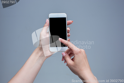 Image of Closeup shot of a woman typing on mobile phone 