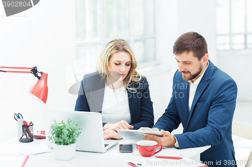 Image of Male and female office workers.