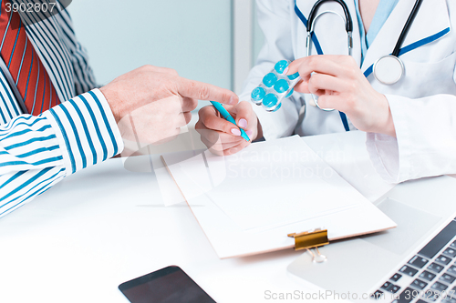 Image of The patient and his doctor in medical office