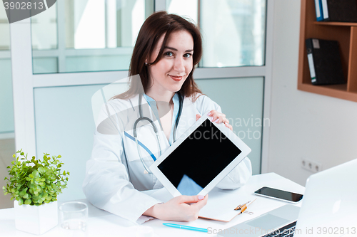 Image of Woman doctor sitting at the table