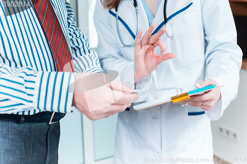 Image of Close-up of doctor and patient hands