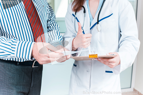 Image of Close-up of doctor and patient hands