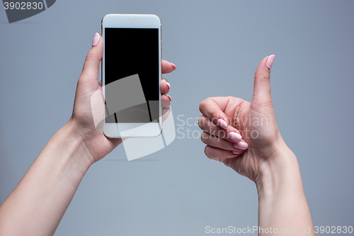 Image of Closeup shot of a woman typing on mobile phone 