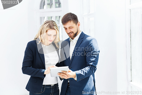 Image of Male and female office workers.