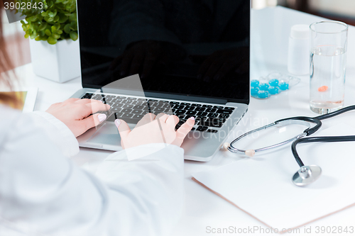 Image of Doctor working on a digital tablet