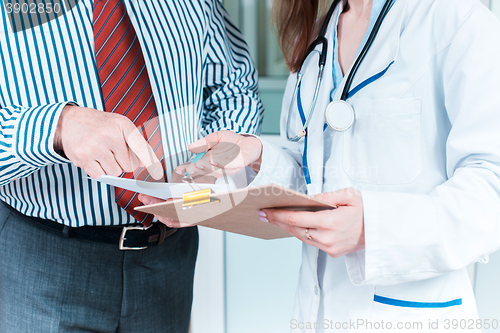 Image of Close-up of doctor and patient hands