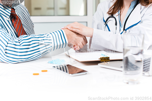 Image of The patient and his doctor in medical office