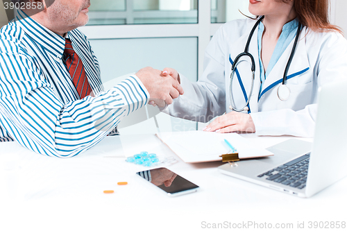 Image of The patient and his doctor in medical office