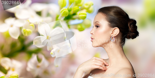 Image of close up of beautiful woman face with earring