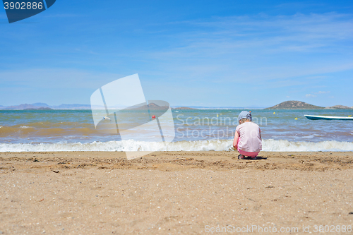 Image of Small girl playing on the Mar Menor beach