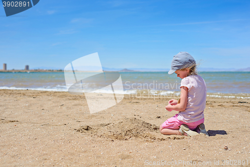 Image of Little girl playing on the Mar Menor beach